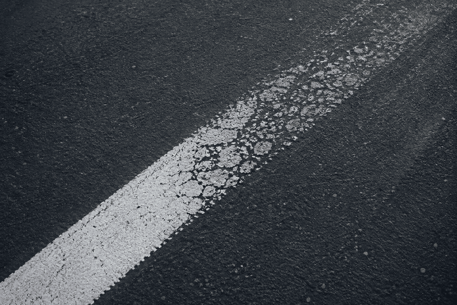 Road striping showing healthy and deteriorated condition